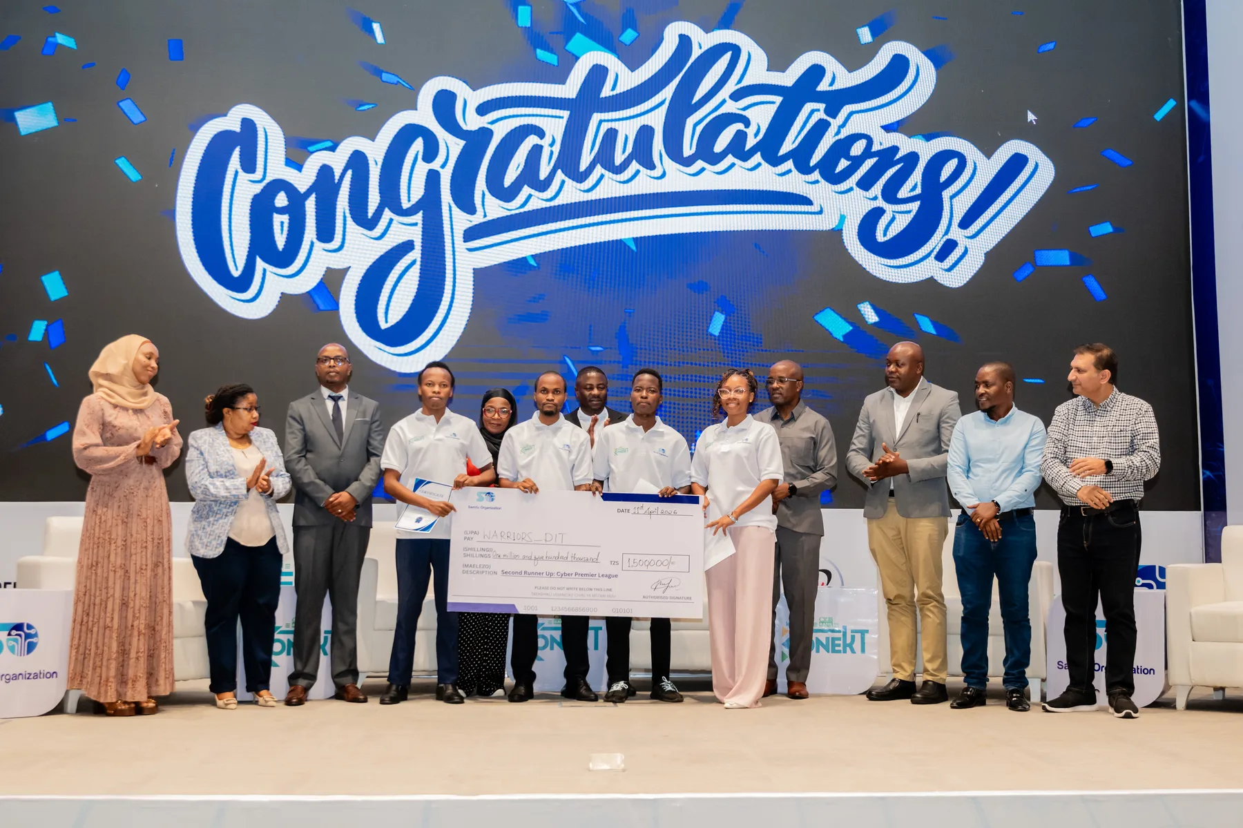 Cyber Champions 2026 team holding an award cheque on stage