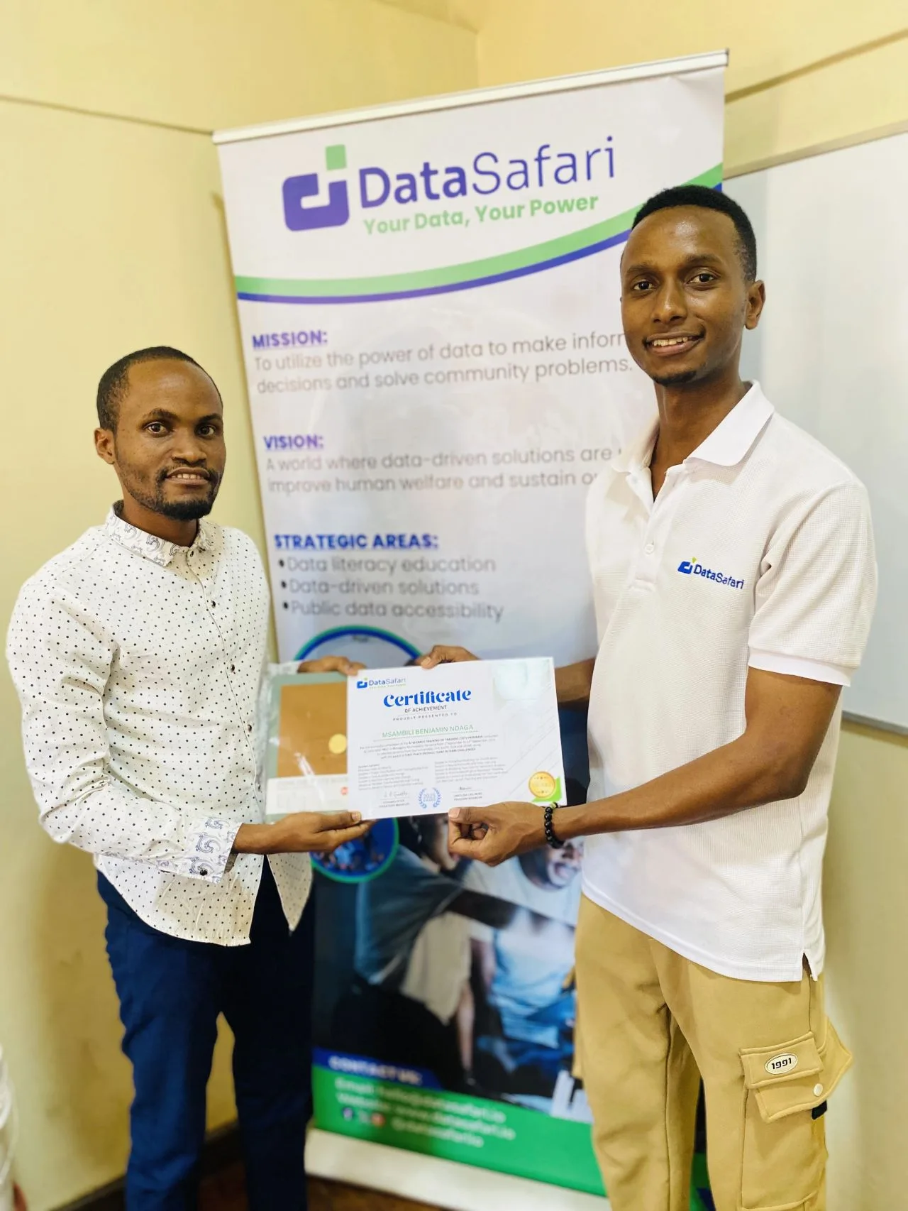 Msambili Ndaga receiving a certificate during Data Safari AI Wizards training