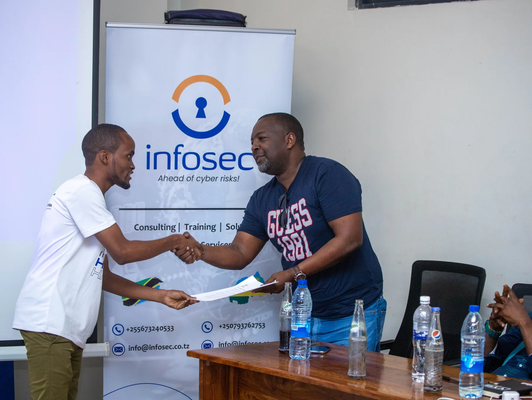 Msambili Ndaga greeting a guest during a DIT cybersecurity club event